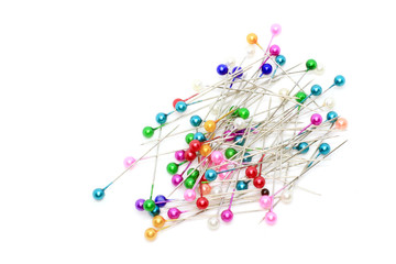 photo of a colorful pin needle on a separate white background