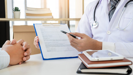 Doctor giving medical consultation diagnostic,Medical physician working in hospital, Healthcare concept.