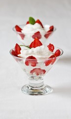 cheese cream. whipped curd cream with strawberries. Homemade cottage cheese is whipped with cream.  A useful dessert. On a light background.