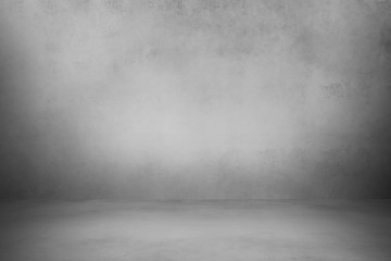 Empty room with white wall and concrete floor	