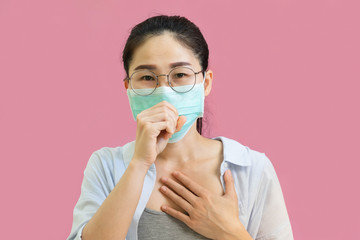 Young asian woman wore a gray undershirt, Blue shirt and protective masks against virus and air...