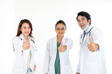 Fototapeta premium Asian Malay Chinese male female three doctors thumbs up towards camera on white background