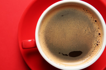 Cup of hot coffee on color background, closeup