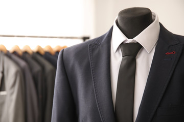 Mannequin with male suit in shop