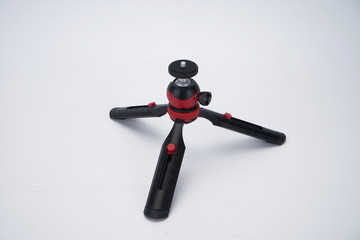 Black mobile phone stand, octopus tripod in white background isolation
