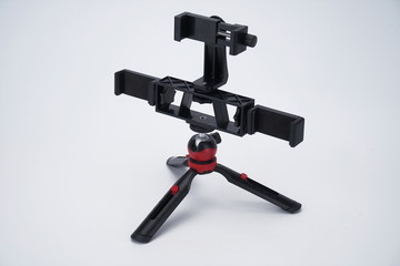 Black mobile phone stand, octopus tripod in white background isolation