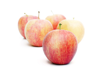 five red and yellow apples isolated on white background