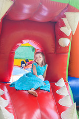 young girl in a bouncy castle