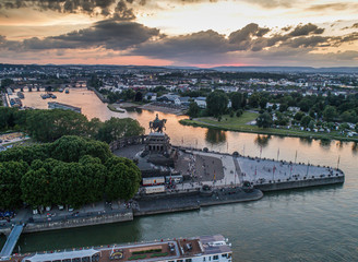 Fototapeta na wymiar Sunset in Koblenz City Germany historic monument German Corner where the rivers rhine and mosele flow together