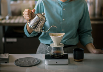 Fototapeta na wymiar Barista making drip coffee.