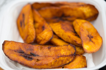 Sweet ripe fried plantains in selective focus, breakfast