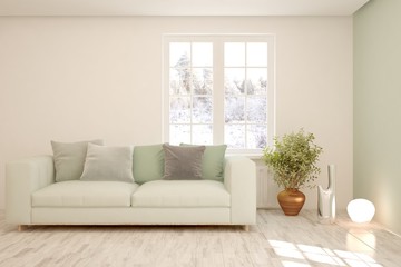 Modern living room in white color with sofa and winter landscape in window. Scandinavian interior design. 3D illustration