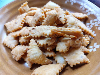 Namakpara (Khurma, Nimki, Mathri) which are  crispy, crunchy and savory strips in a bowl.