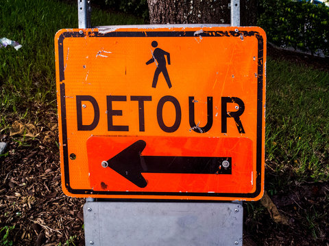Detour Orange Sign with a Black Arrow