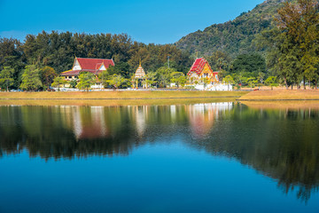 Naklejka na ściany i meble Temple with its reflection in the lake on the Nai Harn beach in Phuket, Thailand