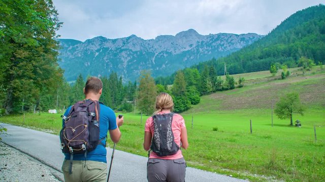 adventurous couple starting hiking the beautiful mountains of Topla Valley, Alps