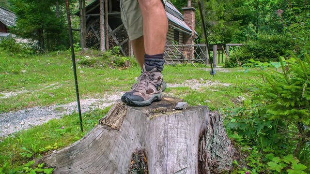 Close up slowmotion of a man and woman stepping on a tree. hiking adventure through forest. Topla Valley, Slovenia