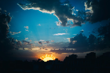 Blue sky with covid-19 sunset or sunrise on the city, world epidemic dangerous news for corona...