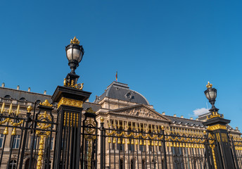 Fototapeta premium Royal Palace of Brussels with decorative fencing and lanterns in the foreground. The center of the capital of Belgium.