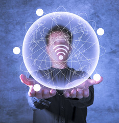 Two open hands and Graphic globe, orbit, wifi symbol worldwide communication network connection 