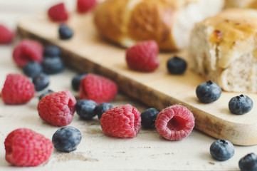 Fresh berries served with hot cross buns, traditional Easter pastry. Blueberry and raspberry