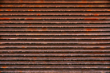 Old Roll-up Garage Gate. Old rusty garage doors.