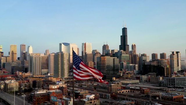 Chicago Cityscape and American Flag Waiving in the Wind