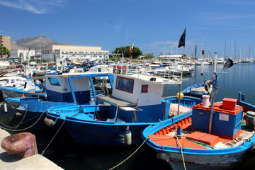 evocative image of fishing boats in port