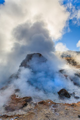 Boiling red mud pools in the geothermal area Sol de Manana in western Bolivia near Uyuni at an elevation of 15,900 feet resembling a landscape on planet mars.