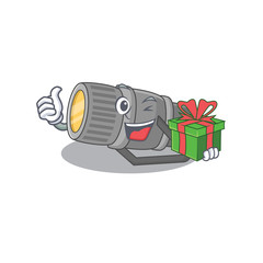 Smiley underwater flashlight cartoon character having a gift box