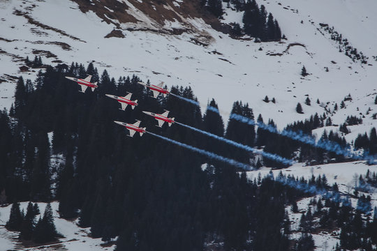 LES DIABLERETS, SWITZERLAND, 10.1.2020: Patrouille Suisse formation display team of the Swiss Air Force flying Northrop F-5E fighter aircraft over the alps close to Les Diablerets.
