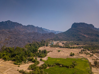 Fototapeta premium Amazing Laos landscape - drone shot of beautiful mountains at sunset