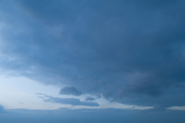 Beautiful sky with stretched clouds during twilight.