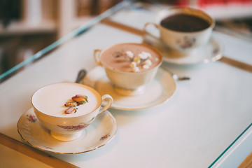 Hot chocolate served with flower decoration. New barista style. 