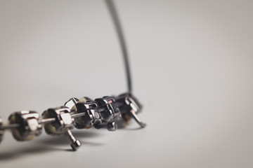 Macro photo of dental braces without teeth, dismounted from mouth, nobody on the picture. Dental...
