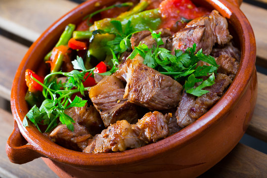 Tasty dish ghiveci of bulgarian cuisine of beef  with paprika  at clay pot