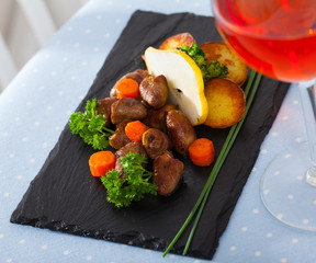 Braised chicken hearts with baked potatoes, carrots, fresh pear