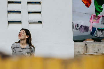 portrait of young woman with laundry