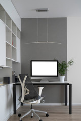 Home working place with modern desk and mock-up computer monitor.
