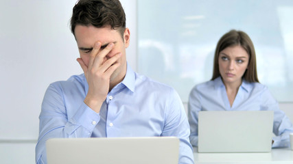 Obraz premium Sad Businessman Upset by Loss at Work