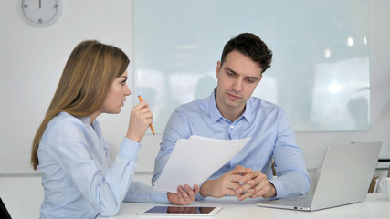 Obraz premium Business People Discussing Project Documents, Paperwork