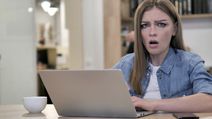 Shocked Creative Man Wondering and Working on Laptop