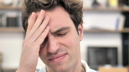 Close Up of Young Man with Headache