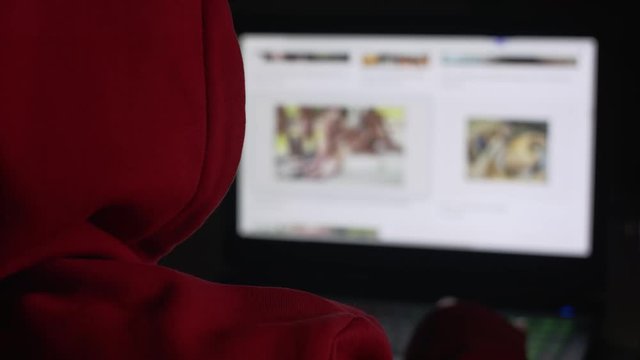 Social distancing and pornography. Unrecognizable person browsing the porn sites at night
