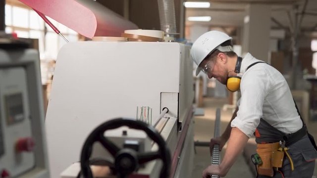 upset worker knocking hard hat