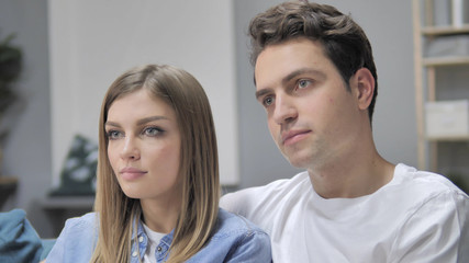 Close Up of Young Couple Looking at Camera