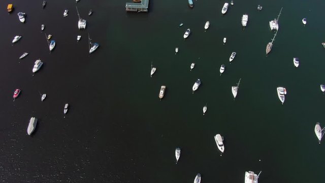 Hundreds of Boats at Hebe Haven of Sai Kung peninsula Hong Kong, Tilt up aerial shot.