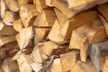 Side view of a pile of firewood, selective focus.