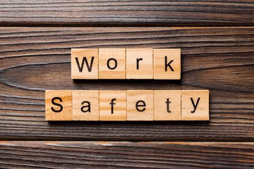 work safety word written on wood block. work safety text on table, concept