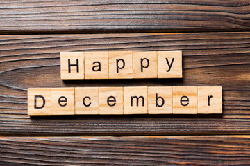 Happy december word written on wood block. Happy december text on table, concept